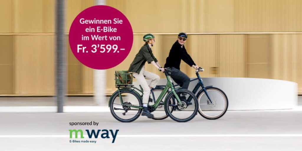 Zwei Personen fahren auf EGO Movement E-Bikes durch die Stadt – Wettbewerb von Orell Füssli und m-way